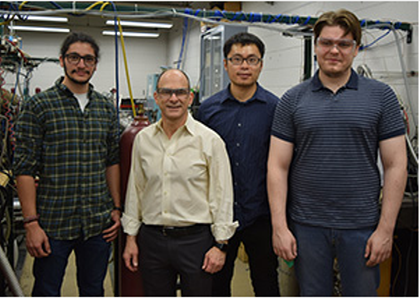 Professor Brezinsky with students at lab