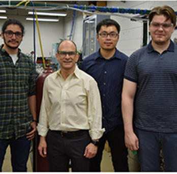 Professor Brezinsky with students at lab 