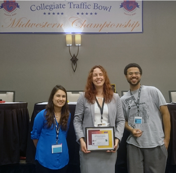 Diana Briones, Austin Bernat, and Natalia Kuvakina accept certificate 