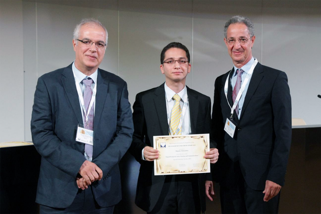 Professor Soltanalian holding award certificate