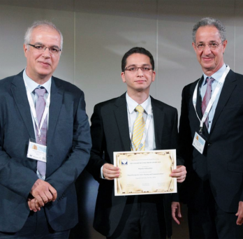Professor Soltanalian holding award certificate 