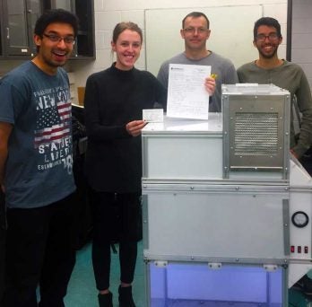 Students with finished sanitary cabinet 