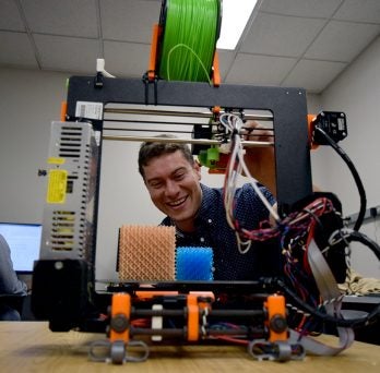 John Klein using a 3D printer
                  
