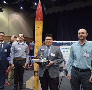 Students display rocket and rover
                  
