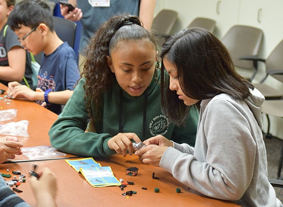 Students play with Legos