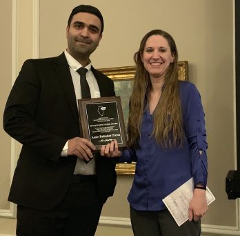 Amir Bahador Parsa receives award plaque 