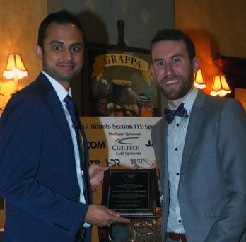 Nima Golshani and Nabin Kafle receive award plaque 