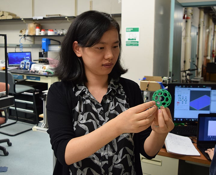 Professor Pan holding printed structure