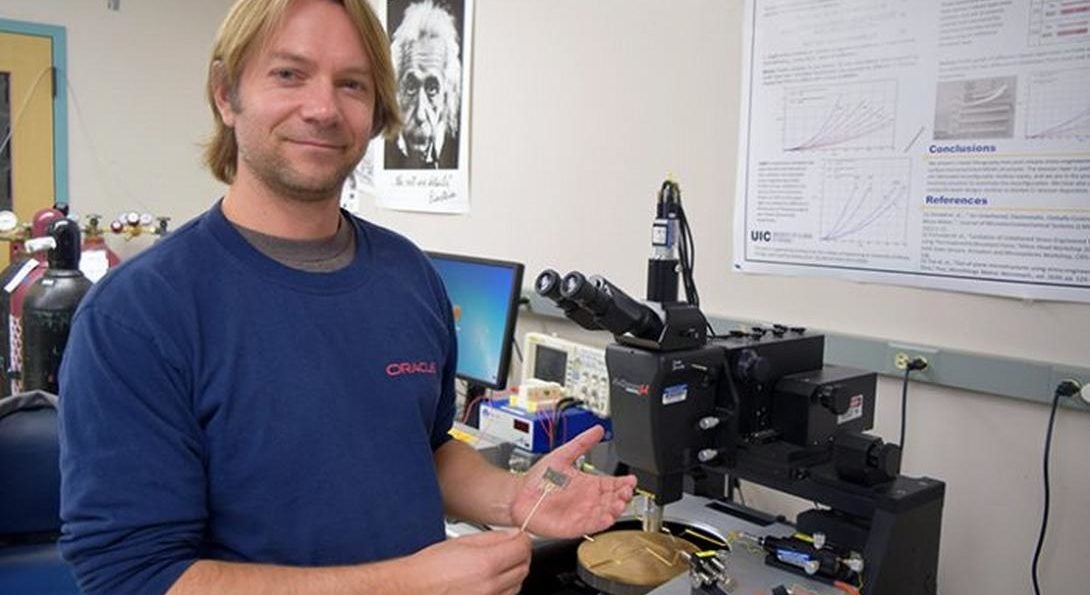 Professor Paprotny holding air quality sensor