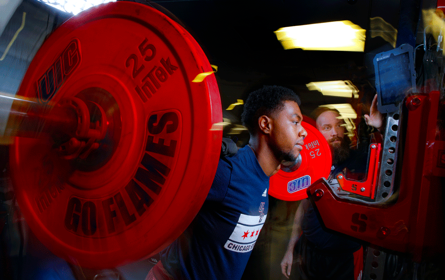 Student lifting weights