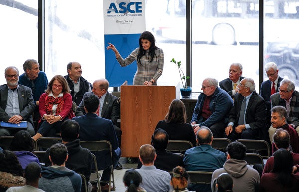 Alumna Michelle Calcagno speaking from a podium at the ASCE Legends event