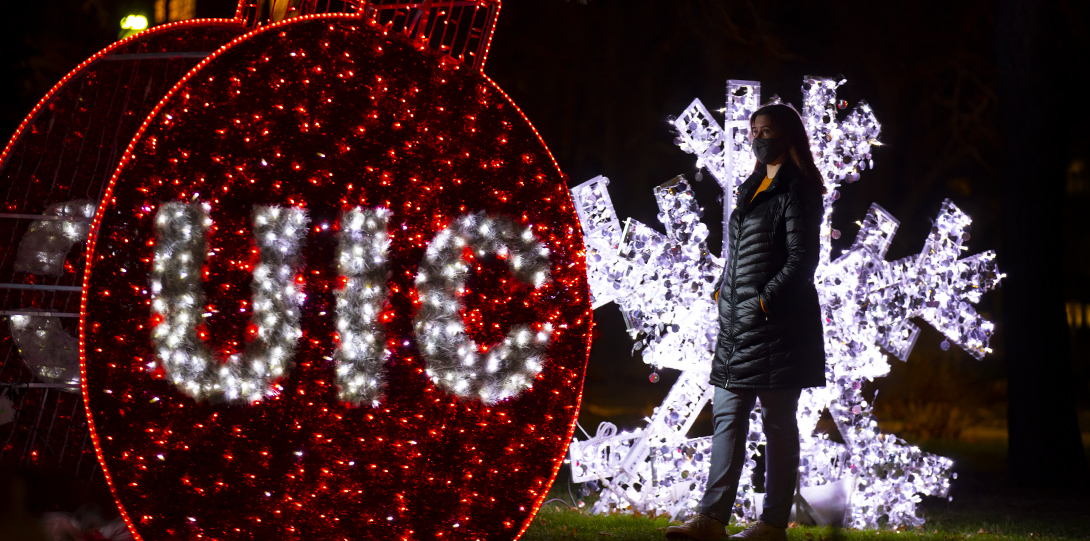 A University of Illinois Chicago student admires the Holiday Lights outside the Student Center West