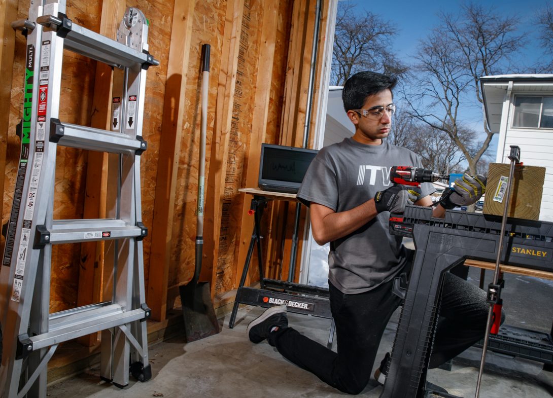 Khateeb Raza works on an internship project in his garage