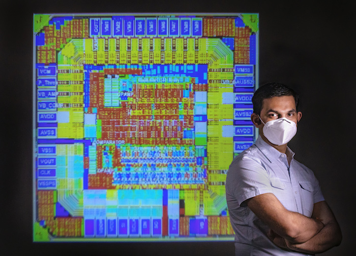 Amit Trivedi, next to an enlarged image of a computer chip