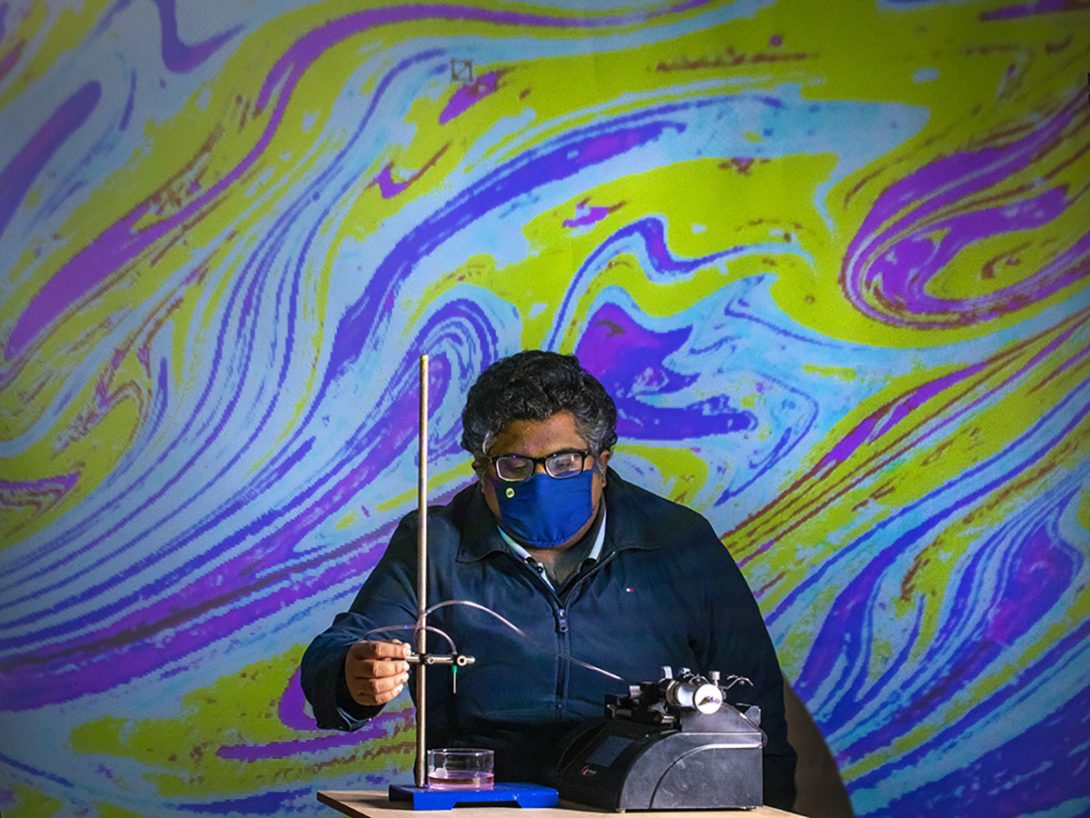 Varun Kulkarni, a post-doc researcher, investigating oil droplets in water