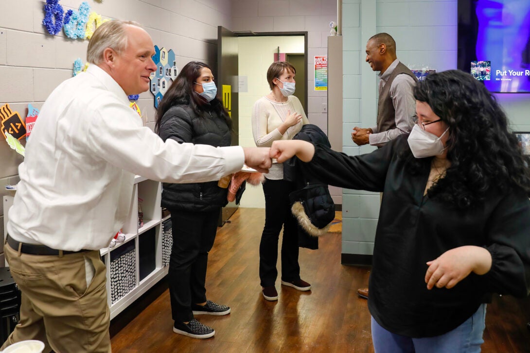 College of Engineering Dean Peter Nelson fist bumps WIEP associate director Sabrina Jones at the WIEP Meet and Greet