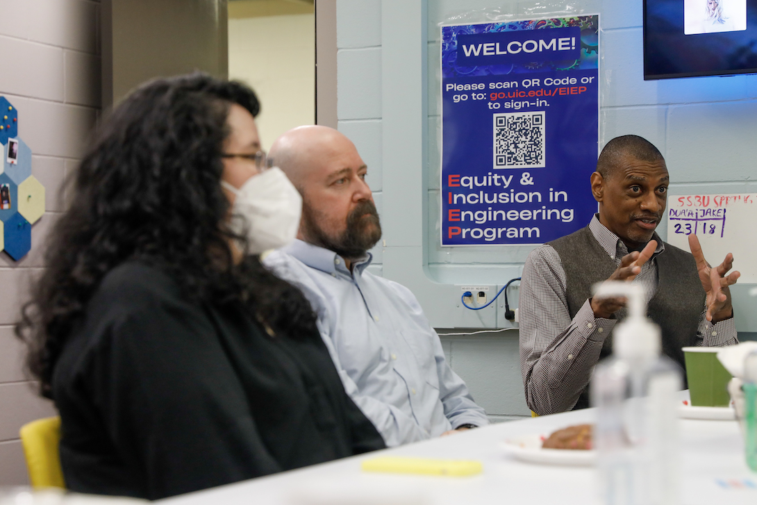 University of Illinois Chicago College of Engineering's Sabrina Jones (front) and Keith Williams (R) chat with others at EIEP.