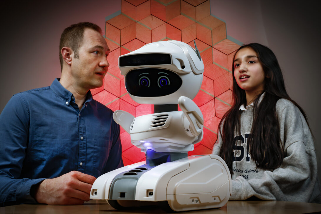 zayna babar and professor michaelis with misty the robot