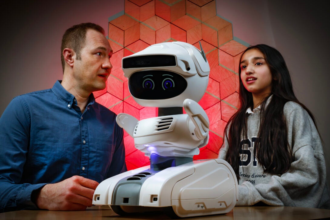 zayna babar and professor michaelis with misty the robot