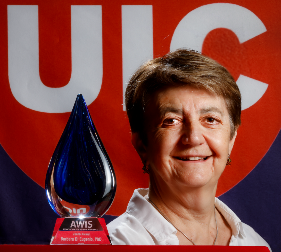 Professor Barbara Di Eugenio smiling in front of her 2022 Association of Women in Science Zenith Award