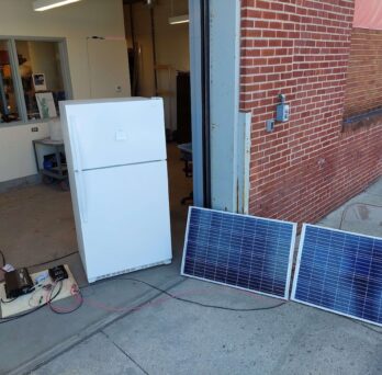 Team AC2DC's refrigerator with solar panels and controls 