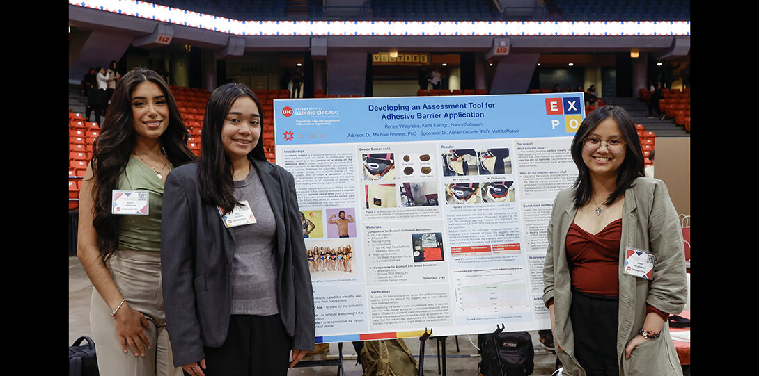 group of students pose with poster explainung their research