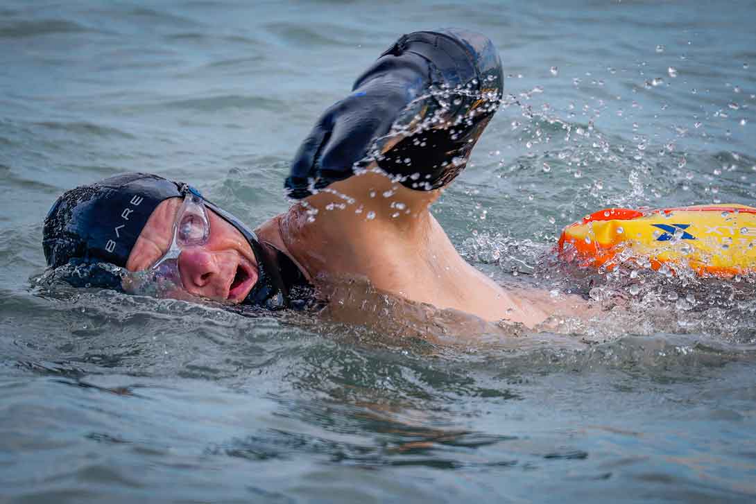 Peter Nelson swimming in Lake Michigan off of Gillson Beach in Wilmete on February 8.