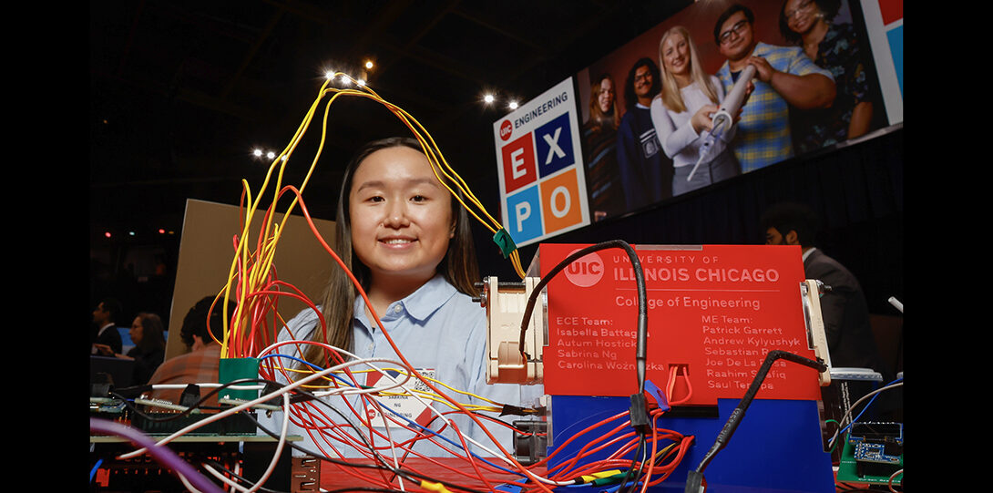 student photographed with wires from electronic device