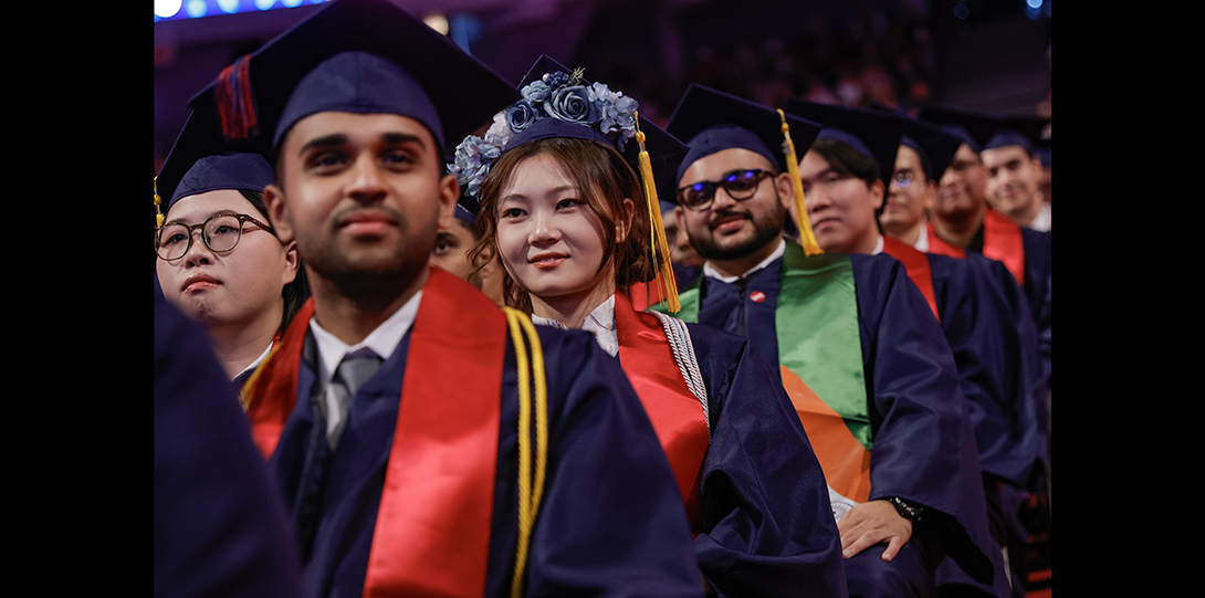 a row of students wearing caps and gowns