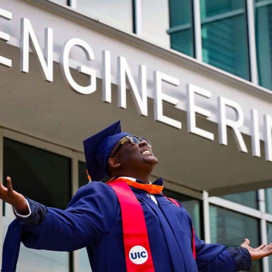 student in front of engineering building