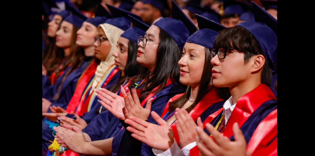 students clapping during ceremony