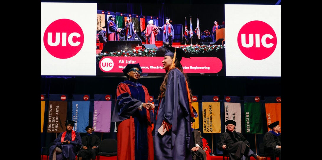 student on stage with dean