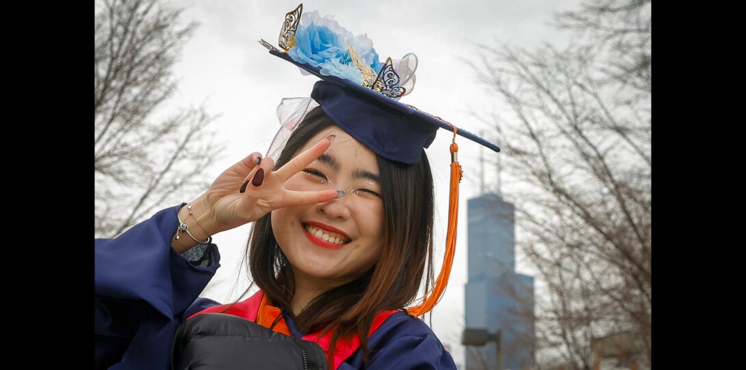 student with a peace sign