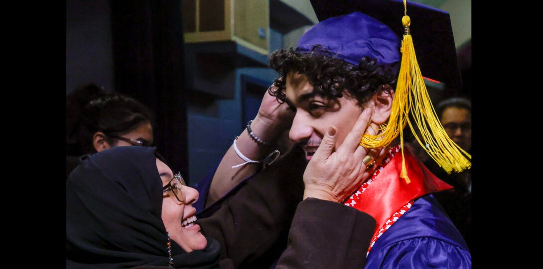 family member embracing student