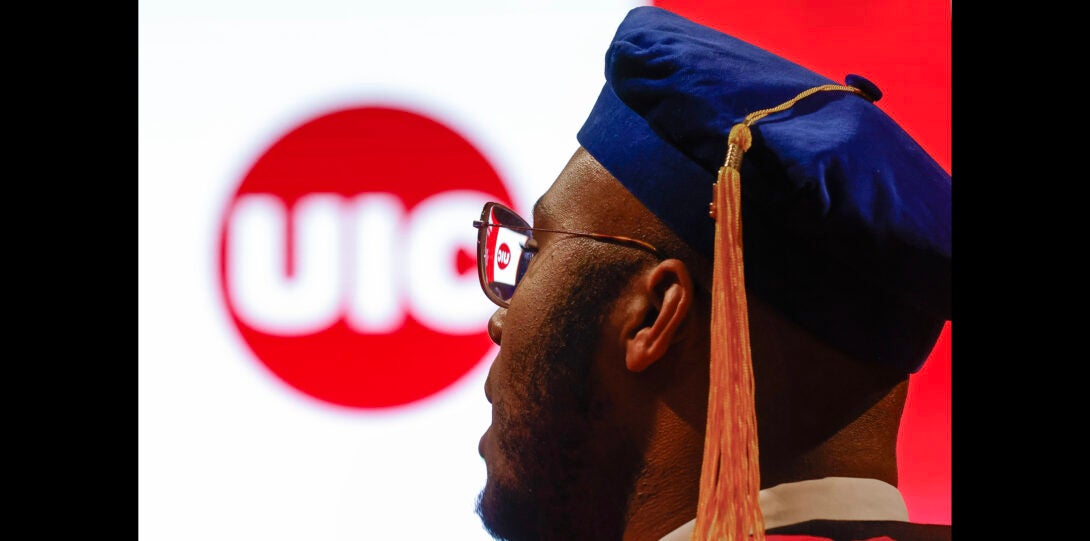 student with UIC logo in background