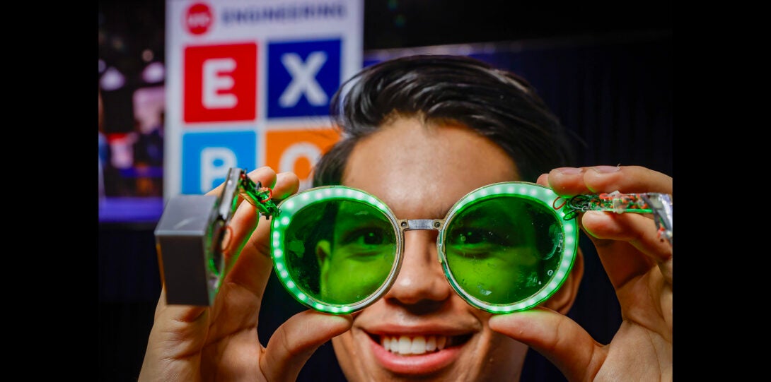 pose poses for a photo with special glasses used to treat headaches