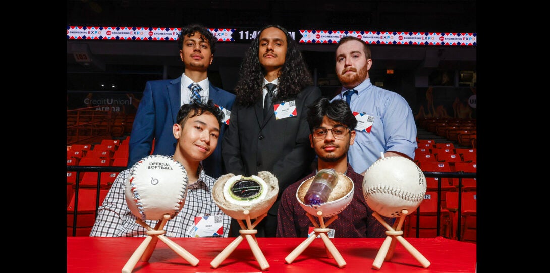 students pose research project basedon baseball technology