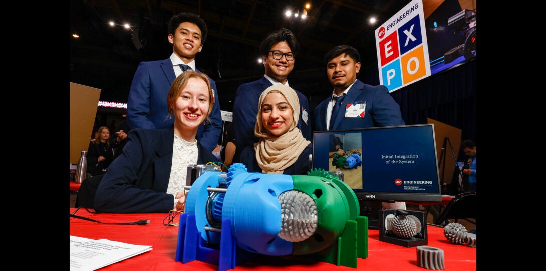 group of students pose with 3D printed research project