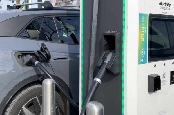 An electric vehicle gets a charge at an electric charging station