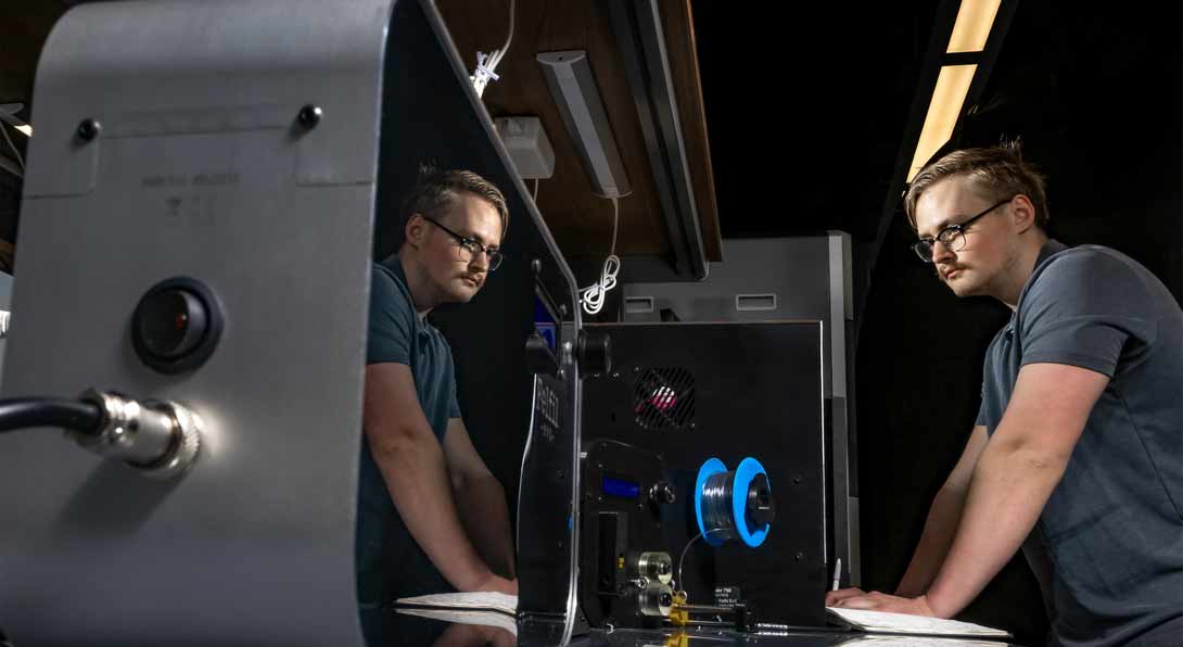 MIE PhD student Daniel Brudniak works on additive manufacturing recycled filament production in professor Didem Ozevin’s lab